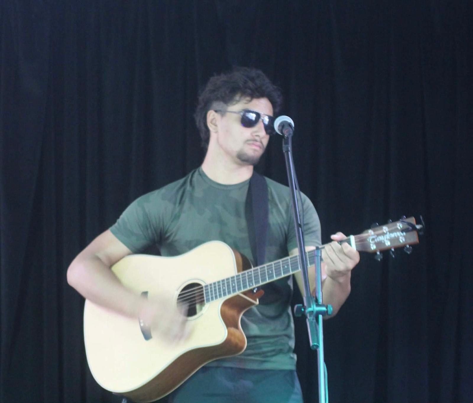 Shades on, locked into the song
